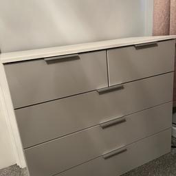 Rauch set of drawers 2 over 3 in white carcass and grey drawer front with soft closing drawers.