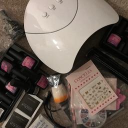 Uv lamp and everything included, I have used the base and top coats and 2 of the colours but aside from that it’s unused - buyer can have these or purchase new ones. Uv lamp working. Nail art things included, cuticle oil and tools etc.
