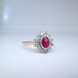 A beautiful natural bezel set Ruby & Diamond flower shaped ring

Professionally cleaned & polished & presented with a brand new ring box

Ring size O
If you would like this ring re-sizing please get in touch

9ct yellow gold
3.1 grams
.50ct oval cut Ruby
.40ct round brilliant cut Diamonds (si2-h)
Hallmarks: 375, Anchor, A, .40

Free next day delivery
Worldwide shipping
Returns always accepted
Any questions, please don't hesitate to ask