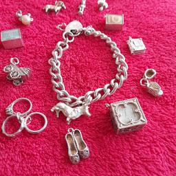 vintage sterling silver charm bracelet plus various charms 
some of the charms are marked 
some are not.
does show some signs of wear and tear 
but still a nice collectable bracelet and charms 
the weight is approximately 67 grams 
a friend borrowed me these little scales, 
so as you can see the weight is displayed on the scales 
listed on other sites 
collection only Coventry