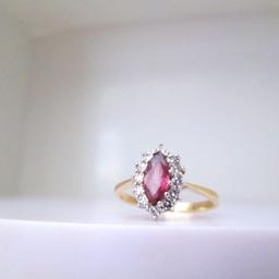 A beautiful natural pink Sapphire & Diamond halo ring

Professionally cleaned & polished & presented with a brand new ring box

Ring size O
If you would like this ring re-sizing please get in touch

Made in 1988

9ct yellow gold
2.4 grams
.75ct approx Marquise cut pink Sapphire (8x4mm)
12 round cut Diamonds (.18ct)
Hallmarks: Crown, 375, Leopard, O
Head measurements: 12.3mm x 8.7mm

Free next day delivery
Worldwide shipping
Returns always accepted
Any questions, please don't hesitate to ask