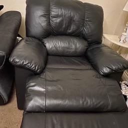 Black leather manual recliner armchair in excellent condition. Collection only .
