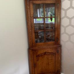 This is a solid wood corner unit in yew on oak which is of superior quality.

It has a glass fronted, display cupboard at the top and a shelved cupboard underneath.

It is 179cm high and 74cm wide.

It is part of a range I have from BATHEASTON which include a side board, lamp tables and 7ft table and chairs which are also being sold.

It is in as new condition and is currently £3442 new.