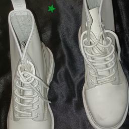 dr martens mono white boots with a couple off stuffs you may be able to get them off . I can post if you need me to royal mail recorded delivery xx size 7 man's or lady's.
