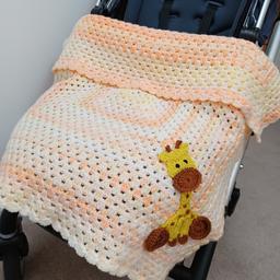 A gorgeous handmade crochet baby blanket with giraffe applique. 

The blanket measures approximately 27 inches or 70cm square and is made using soft baby marble acrylic wool. It is the perfect size for a pram or crib and will keep little babies warm. The little giraffe is appliqued into one corner and is sewn on so that the stitches are not visible. The giraffe measures approximately 7 inches or 18cm tall. 

This blanket is perfect for a baby boy or girl as it is in neutral yellows.