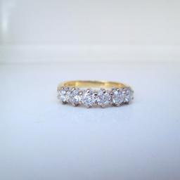 A beautiful natural Diamond eternity ring

Professionally cleaned & polished & presented with a brand new ring box

Ring size P
If you would like this ring re-sizing please get in touch

Made in 2002

18ct yellow gold
4.1 grams
6 round brilliant cut Diamonds
1.00ct total Diamond carat weight
Si2-G clarity & colour
Hallmarks: 1.00, Crown, 750, Leopard, C

Free next day delivery
Worldwide shipping
Returns always accepted
Any questions, please don't hesitate to ask