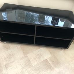 Black TV stand with 4 parts all with cable holes 
Length 40”
Width 16”
Height 18.5”

Can deliver local