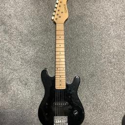 Elevation Black mini electric guitar, also suitable for children. Perfect condition and in excellent working order. Right hand strung. Comes with fitted case/sleeve.

Case is slightly damaged, front zipper not working and hole in the bottom of the sleeve but still protects guitar.

Collection from B69

Cash in collection