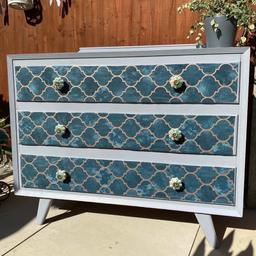 Beautiful vintage style dresser, painted Grey/blue. papered with Emerald Green & Gold trellis wallpaper, and drawers complete with decorative knobs, this is a popular style at the moment and will add a bit of glamour to your room

There may be a few minor discrepancies, as listed above, this is not a new piece of furniture.