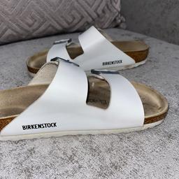 Brilliant white leather size 5 Birkenstocks. Goes with everything. Easy as they just slip on with comfortable soft leather straps. Still brand new. From  clean smoke free home.
