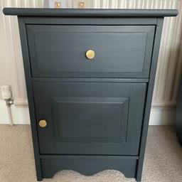 A lovely solid pine cabinet which has been newly painted using a dark teal blue/black colour by Frenchic.  The inside has been lined with a gold paper and new gold handles have been added.
Measurements:- 47cm wide, 40cm deep, 63.5cm tall.