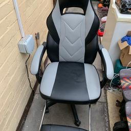 Gaming chair with foot rest wide base used but still good condition it also reclines
