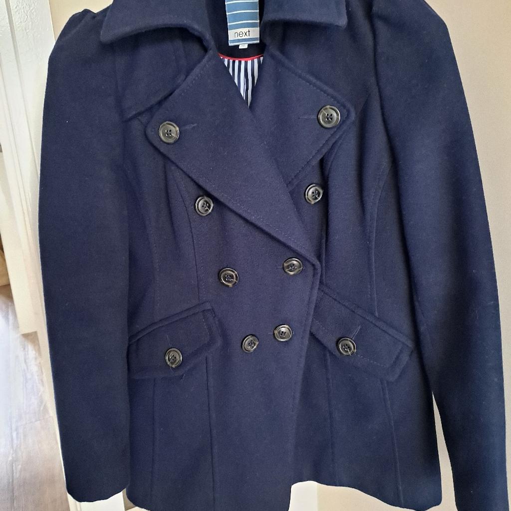 Navy blue coat by Next with button details and fully lined. Good condition size 10