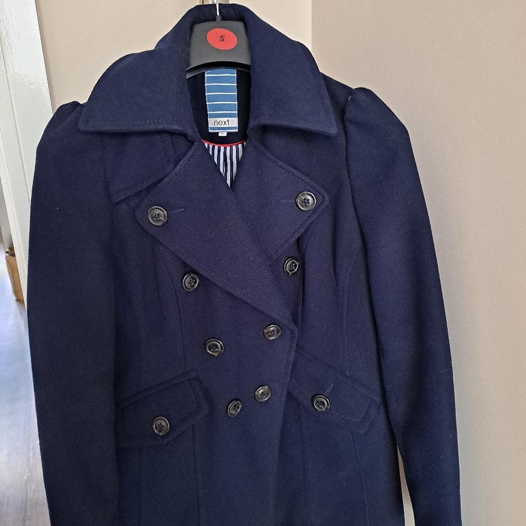 Navy blue coat by Next with button details and fully lined. Good condition size 10