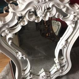 Old French mirror painted white,very pretty and ornate.