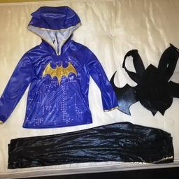 Rubies Official Dc Superhero Batgirl Costume with Black Wings, size is medium, good condition. Would say age range 5-7 years.