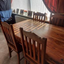Indian sheesham wood dining table and chairs.
Used but in great condition.
53 inches long
36 inches wide.