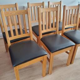 6 Solid oak dining chairs with black leather seats . Collection only, heavy, sturdy chairs.
Height of chair 94cm, seat height 46cm. Seat width 44cm and 46cm deep at furthest point.