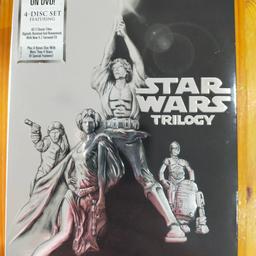 4 disc-set including A new hope, The Empire strikes back, Return of the Jedi and a bonus material DVD. The embossed box shows slight signs of wear and tear but the DVDs and their cases are impeccable as only used once.