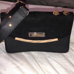 River island black detailed clutch bag with gold chain used once in great condition like new collection only