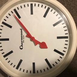 Large wall clock. Works fine. Cream with white face