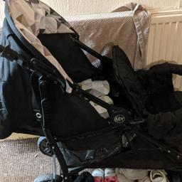 double tandem pram, back seat suitable from birth, front seat from 6 months. bought when having 2nd child for days out, but couldn't go out due to lockdown. only been used few times. comes with rain cover. only issue is small rip in rubber of handle on one side (see photo). folds into umbrella style. bought new for £250. removable hood at front. Will deliver locally.