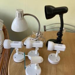 4 white spotlights and 2 desktop lamps, all metal, nearly new with the exception of the white desktop lamp.