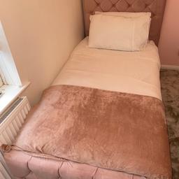 Girls single fabric bed with button details on both footboard and headboard. Really reluctant to sell but selling as my daughter needs a bed with more storage. Only had for 8 months. Really good condition. Mattress not included.