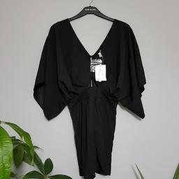 BNWT Asos UK10 black playsuit. Collection or postage (Royal Mail second class with signature £4,20). Any questions feel free to ask. All my items are on other sites. Open on sensible offers on bundle. Please have a look on my other items