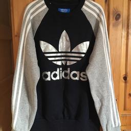 Adidas Top Blue & Grey sleeves with 3 white stripes down each side & silver Adidas logo on the front
UK Size 10
Good condition
From a Pet & Smoke free Home
Can post if buyer pays postage cost