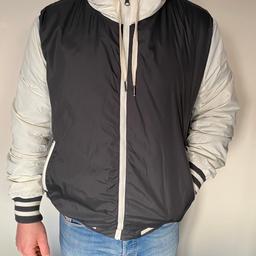 H&M men’s bomber jacket. 
Size XL
Hooded lightweight jacket with zipped pockets and zip at the front.
One inside pocket. 
Dark grey with cream coloured hood and arms.
Used but in good condition.