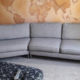 This is originally from scs 2 1/2 years ago its a grey material with silver flecks in it ,difficult to explain ,its very modern design its in used condition but good ,the sofa is on a angle not a quite a coener sofa ,non smoking house ,need gone due to new one arriving next week ,all seat covers come off ,zips all in tact no rips no tears ,open to offers but not silly ones thanks .COLLECTION ONLY.