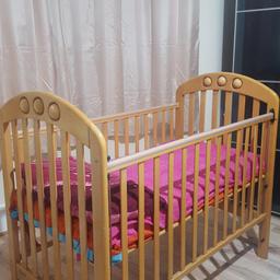 Cot bed with mattress and mattress protector. In great condition. One side can be moved up and down or completely removed to use as a toddler bed.Perfect condition cot in solid wood. Comes with mattress. Can be set at 3 heights for the growing baby. Can be used from birth to around 3.5feet tall child. One side rail can move up and down for easy handling of baby. Mamas and papas brand.