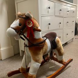 This beautiful rocking horse will be a hit with toddlers anywhere from age 1-4.

It has stirrups, a rein and when you press the ear it makes a galloping / neigh sound and the bottom mouth part moves up and down - really cool!

By Jolly Rein

Can deliver locally