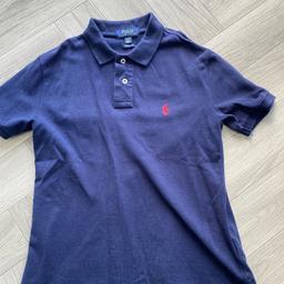 Navy blue with small red logo
Size: Medium (10-12 years) 
Used but in good condition 
From smoke free home