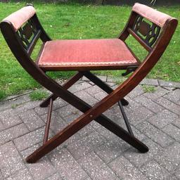 antique x frame seat/chair  folding stool. 
This is a very attractive X frame stool that can fold down for travel and storage, love style and detail. The velvet fabric is probably as old as the stool does need cleaning,
No damage, lovely patina 

Viewing welcome