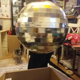 lovely disco ball that comes apart so great to store little precious bits in or just for show in a kids bedroom  even or a kids part if u have lights to aim at it .