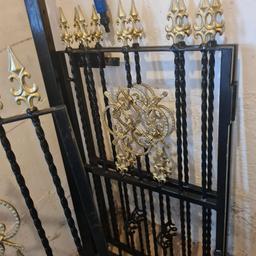 set of black iron gates, with gold leaf decoration, span a width of 8ft7".
excellent condition.