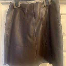 Brand new with tag in packaging brown faux leather mini skirt with size zip and front pockets size 12
