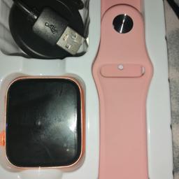 Pink strapped smart watch never used. Comes with charger.