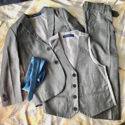 This 4 piece slim fit suit comes with a 2 button jacket, trousers with adjustable waist, matching 4 button waistcoat, and a tie to complement the suit. This premium suit comes in a Milano Mayfair suit bag.

Size 4 years. Only worn once for a wedding.