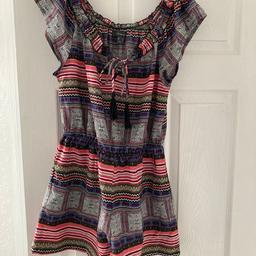 Very flattering Print short playsuit with black tasadle fastening
Work a handful of times and in great condition
perfect for summer and holidays
Size 12
Elasticated waist
Collection Westend, Haydock or can post 2nd class recorded
Comes from a pet and smoke free home