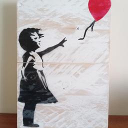 Banksy style 'Girl With Balloon' Wall Art.
Handmade from reclaimed timber. Approx. 29x20cm size. Can be wall hung or stand on a shelf or mantelpiece. Has a varnished finish to preserve the image and make it hard wearing. The piece has been painted with Rustoleum Chalky White chalk paint and then sanded down for a distressed appearance.
All our items are handmade from reclaimed timber which has been carefully sourced from a reputable company to ensure the best quality.