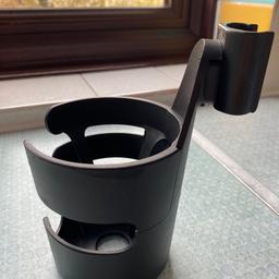 bugaboo cup holder in really good , same signs of use but in perfect condition and working..  fit in all buggies bugaboo … don’t hesitate to ask for any additional information