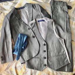 This 4 piece slim fit suit comes with a 2 button jacket, trousers with adjustable waist, matching 4 button waistcoat, and a tie to complement the suit. This premium suit comes in a Milano Mayfair suit bag.

Size 4 years. Only worn once for a wedding. Open to offers!