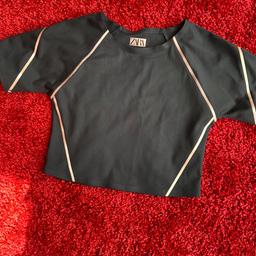 Worn once 
Black and rose gold trimmings for this stylish crop sports top