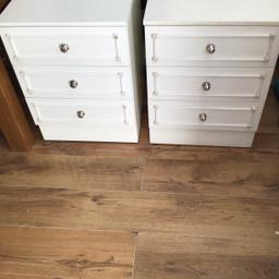 Heavy 2 white bedside tables in good condition very clean inside and out no damage size 25and half ins Height /19ins Width across/19ins Depth front to back / have silver handles 3 draws also have matching chest of draws on my page welcomed to view collection only please 01268 765061 Wickford