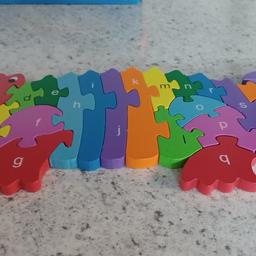 wooden crocodile jigsaw,  can be put together by numbers or the alphabet in excellent condition  £2.50