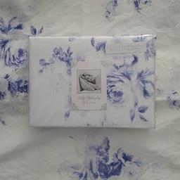 Holly Willoughby. This set comes with a NEW PAIR of pillowcases due to a tie on a pillow case is marked. 1 Duvet cover and 4 Pillowcases. blue and white 100 % Cotton 200 TC. Freshly laundered