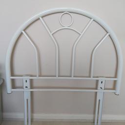 A white metal single headboard in good condition.